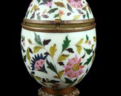 Antique porcelain storage egg jar, especially large, hand-painted, hinged porcelain storage egg jar with bronze hardware.