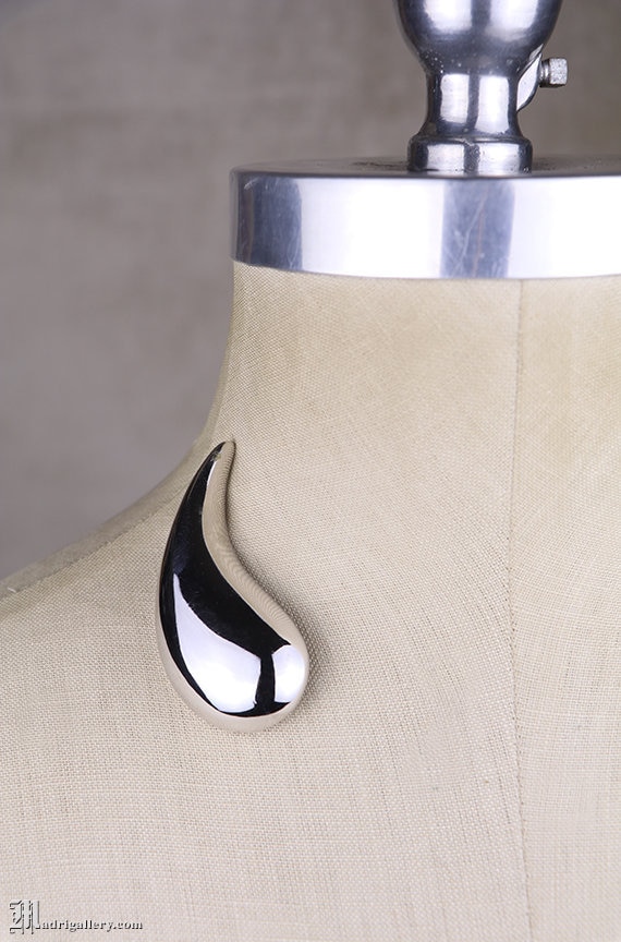 Givenchy chrome brooch, modern modernist silver tone paisley pin, big designer couture statement piece, futuristic space age style, teardrop