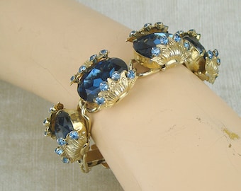 Vintage blue glass bracelet, chunky faceted glass edged in rhinestone in goldtone segments, big statement piece