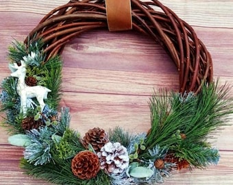 Snowy wicker wreath with pinecones, neutral Christmas decor, winter wreath for front door