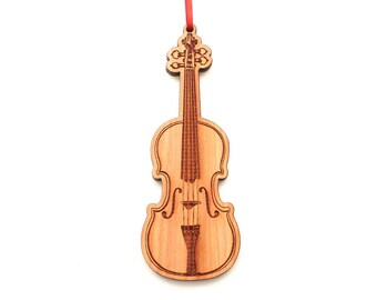 May include: A wooden violin ornament with a red ribbon. The ornament is detailed with a carved violin shape and strings.