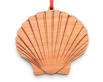 Adorno de concha de vieira: vende conchas de mar junto a la orilla del mar