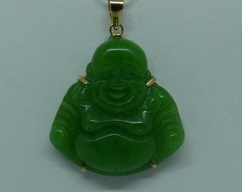 May include: Green jade pendant of a smiling Buddha with gold accents.