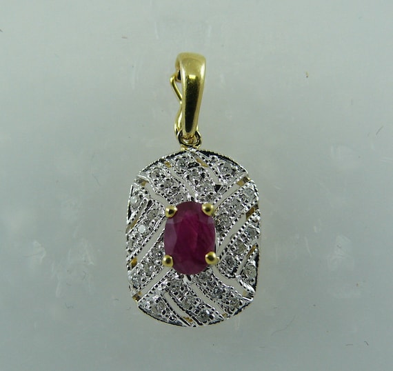 Ruby 0.63ct Pendant 14k Yellow Gold and Diamonds 0.15ct