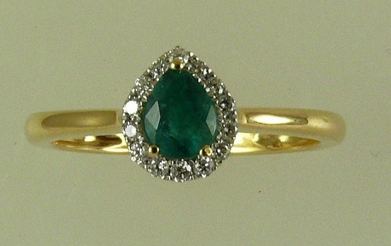 Emerald 0.30ct Ring with 18K Yellow Gold and Diamonds 0.09ct