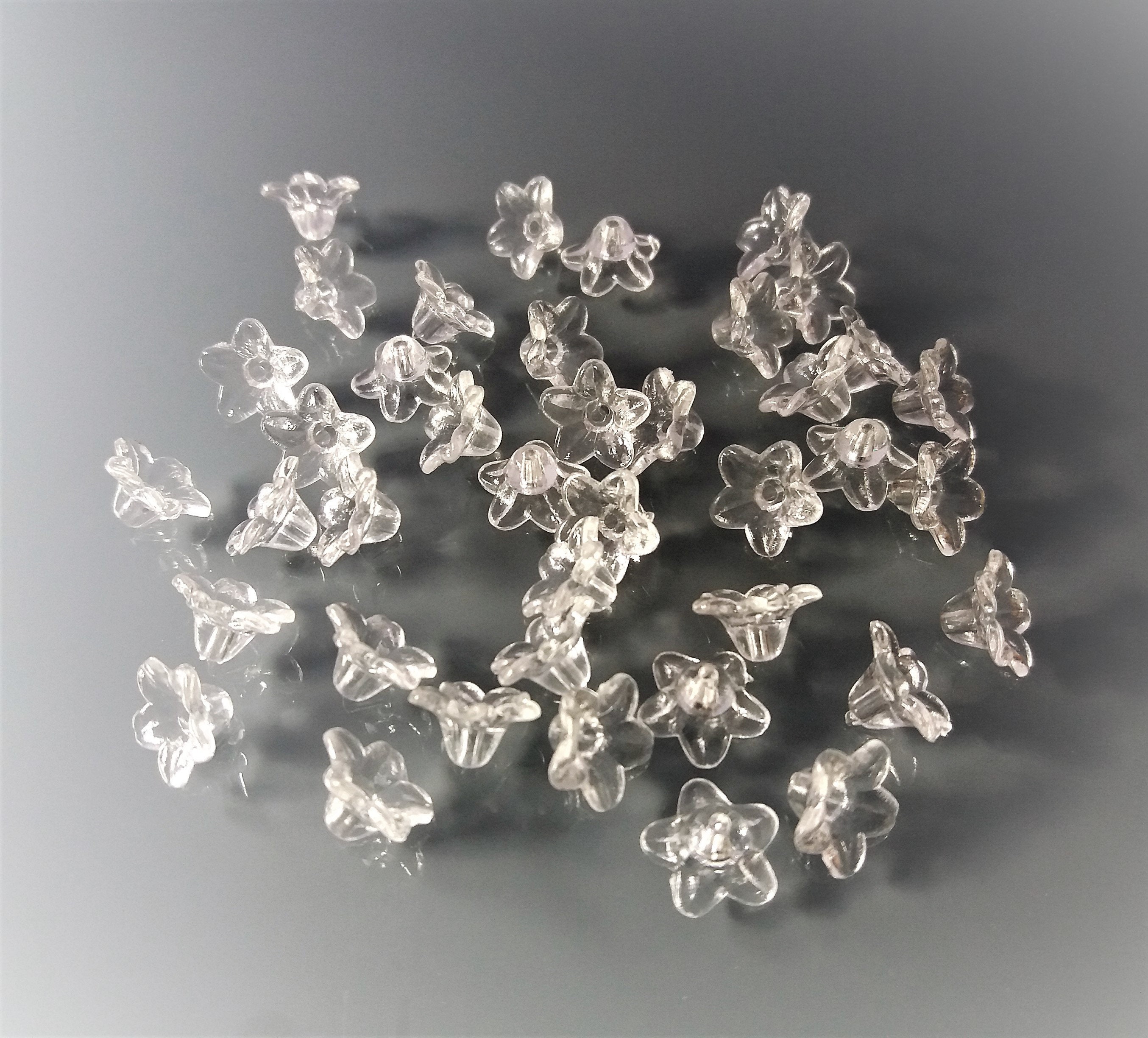 40 perline a forma di fiore in plastica trasparente - Italia