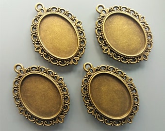 4 pendentifs pour cabochons ovales 25 mm X 18 mm métal coloris bronze