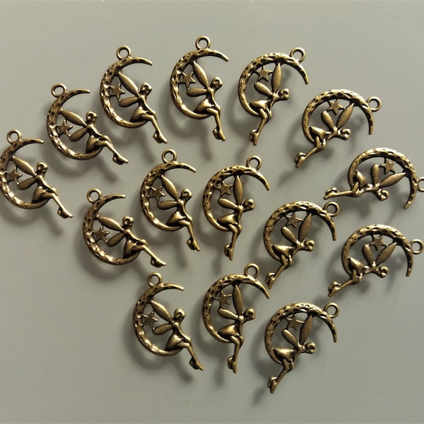 15 pendentifs 25 mm lune, étoile et fée métal coloris bronze