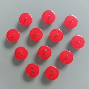 12 pulsanti tondi 12 mm in plastica rossa con riflessi lucidi