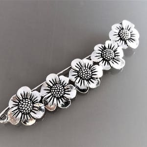 Brooch 8.8 cm flowers metal color silver