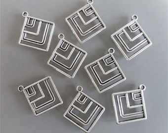 8 diamond pendants in silver color metal