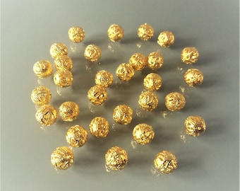 30 perles filigranes 8 mm coloris doré