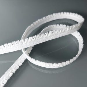 2 mètres de galon coton blanc aspect mini-pompons
