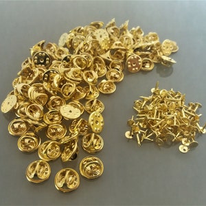 100 gold-colored metal pin holders