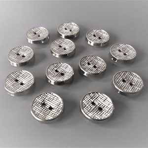 12 round buttons 13 mm silver color and checkered texture on the top