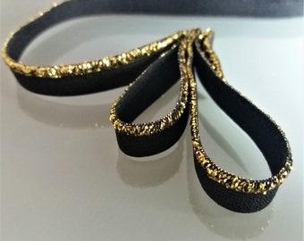 Black elastic piping with gold lurex border