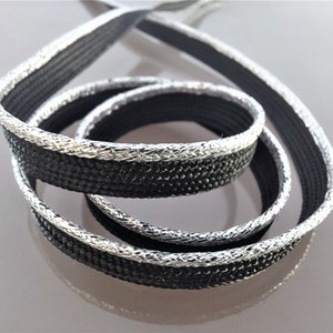Passepoil noir avec bordure en fil lurex argent