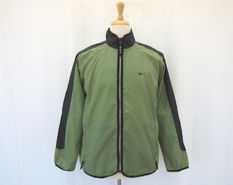 May include: A green and black windbreaker jacket with a zipper closure and a Nike logo on the right chest.