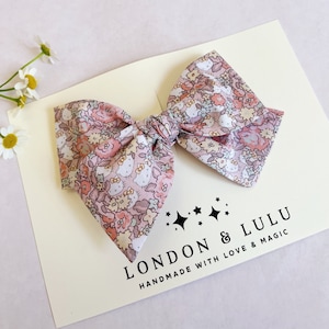 Liberty of London x kitty floral twirl bow girls hair clip toddler pigtails baby nylon headband tan peach pink beige kawaii roses flowers