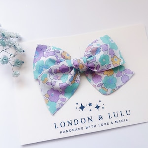 Liberty of London twirl bow Betsy mint lavender girls hair accessories kids toddler pigtails baby nylon headband floral flower tana lawn