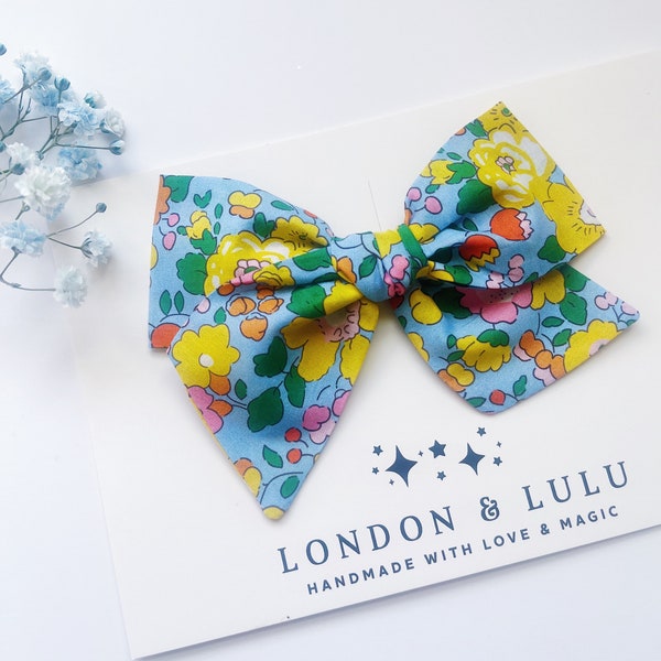 Liberty of London Betsy Field twirl bow girls hair accessories toddler pigtails baby nylon headband sky blue yellow floral flower UK