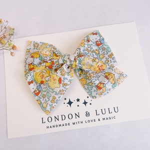 Liberty of London x kitty yellow floral twirl bow girls hair clip toddler pigtails baby nylon headband rainboots gardening garden umbrella image 1