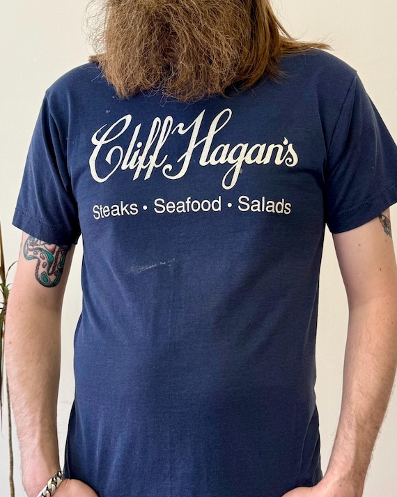 Vintage 1980s Cliff Hagan’s Kentucky Steakhouse Graphic T Shirt | large