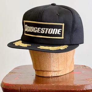 Vintage 1990s Bridgestone Tires Gold Leaf Snapback Ball Cap