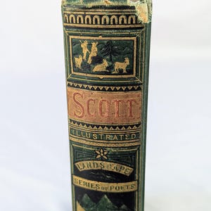 May include: A green hardcover book spine with gold embossed lettering and illustrations. The text reads SCOTT, ILLUSTRATED, LANDSCAPE, and SERIES OF POETS. The spine features decorative borders, a mountain scene, and figures with animals.