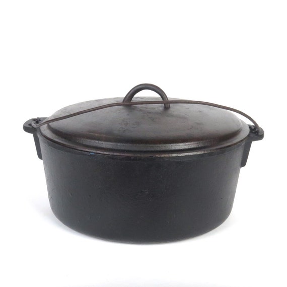 Antique Cast Iron 5 QT. Dutch Oven Pot and Vintage Cooking Utensils W/Wire  Bail Handle And Lid Pot Is Made In USA Replacement Lid from Taiwan - Lil  Dusty Online Auctions 