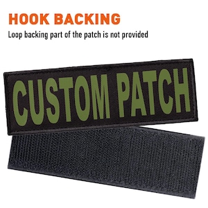 May include: Black patch with green text that reads "CUSTOM PATCH". The patch has a hook backing.