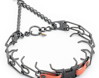 May include: A black metal prong collar with a chain and a quick-release buckle. The collar features a series of prongs and a small orange rubber section near the buckle. The collar is designed for dog training.