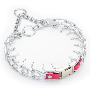 May include: A silver metal prong collar for dogs with a pink leather section and a buckle closure. The collar features a chain design with multiple prongs extending inward. The collar is designed to be worn around a dog's neck.