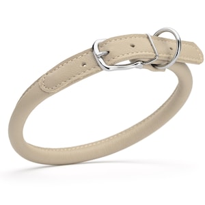 Beige leather dog collar with metal hardware, round design, 1/2 inch wide