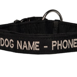 May include: Black dog collar with a silver metal ring and a white embroidered inscription that reads "DOG NAME - PHONE #"