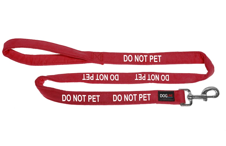 May include: Red dog leash with a silver clip and the text "DO NOT PET" repeated five times. The leash is made by DOGME.