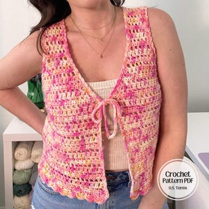 May include: A white ceramic mug with a black handle and the text "But First, Coffee" in a black, bold font. The mug is on a white surface.