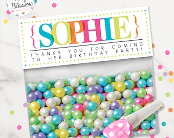 May include: A clear plastic bag filled with colorful sprinkles and a pink polka dot party favor. The bag has a label that says "{SOPHIE} THANKS YOU FOR COMING TO HER BIRTHDAY PARTY!"