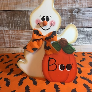 Halloween decor. BOO! Cute wood ghost with pumpkin. Fun Halloween decor. Sits on shelf or hangs on the wall.