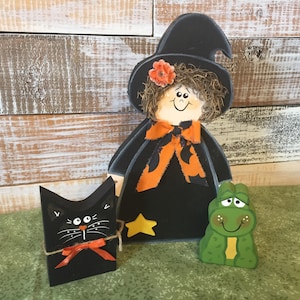 Halloween decor. Cute witch with her own cat and frog. Hand made and hand painted from wood. Fun Halloween decor.
