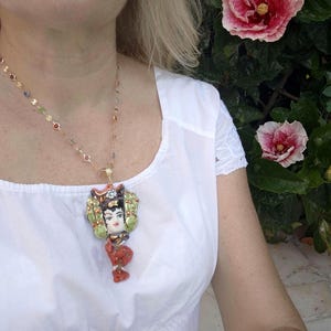 Caltagirone ceramic Moor&#39;s head necklace with red coral and white pearls, Sicilian rosary necklace