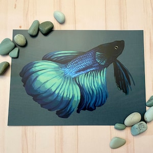 May include: A blue and green betta fish with a long, flowing tail fin. The fish is painted on a dark green background.