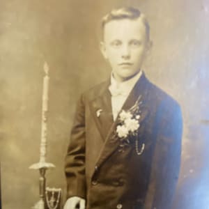 Antique Photo of Young Man in Suit with Candle and Rosary Mackenzie of Dubuque Iowa Cabinet Card Sepia Portrait Photography