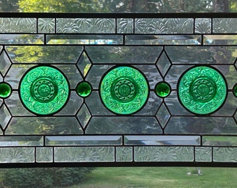 Stained glass transom with vintage green dishes