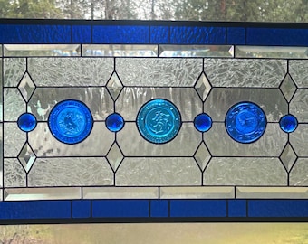 Cobalt blue, stained glass transom window with vintage Pairpoint cup plates.