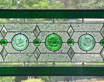 Stained glass transom window with vintage pairpoint bird plates