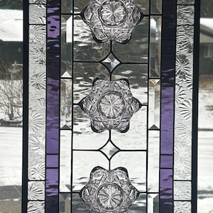 Stained glass window panel. Purple vintage bowls.