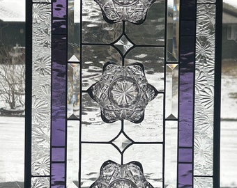 Stained glass window panel. Purple vintage bowls.