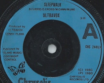 May include: A vintage vinyl record with a blue label featuring the song title "Sleepwalk" by Ultravox. The label includes the Chrysalis Records logo, production credits, and copyright information. The record is a classic music collectible.