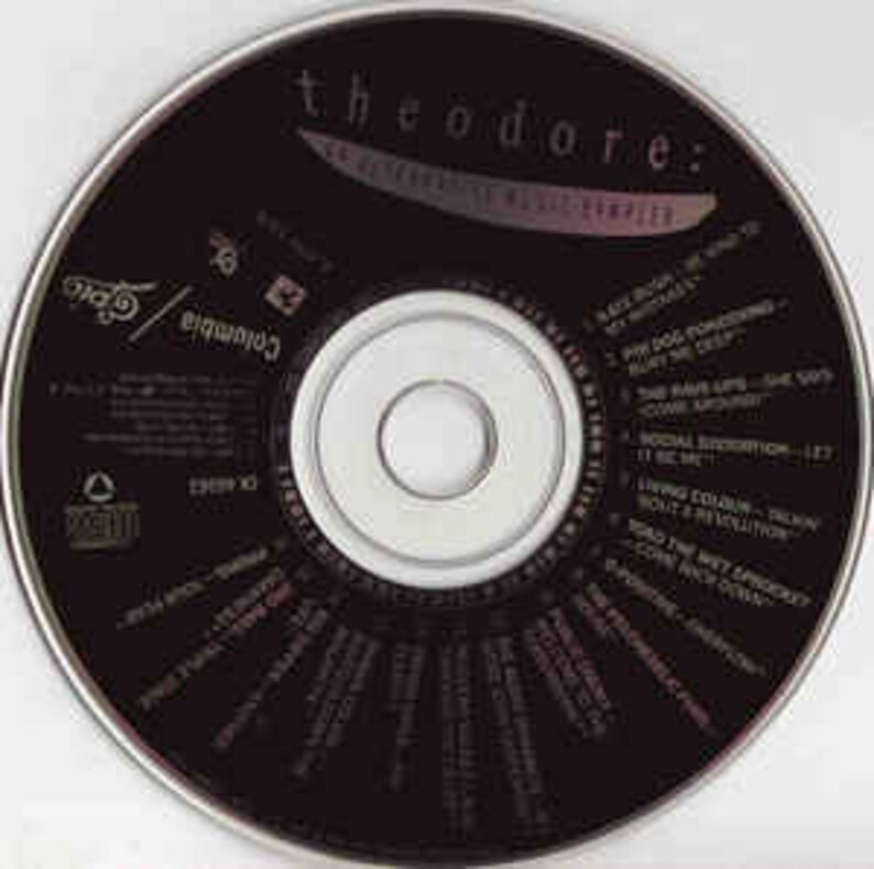 May include: A black CD with the text "The O'Jays: 25 Years of Music Compiled" and a list of song titles.